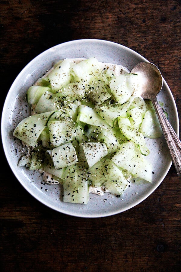 This cucumber salad with tahini-yogurt sauce essentially is a no-cook meal, a refreshing salad to make good use of those cool summer cucs, which might just be arriving in droves. I serve it along side broiled slices of ciabatta. Yum. // alexandracooks.com