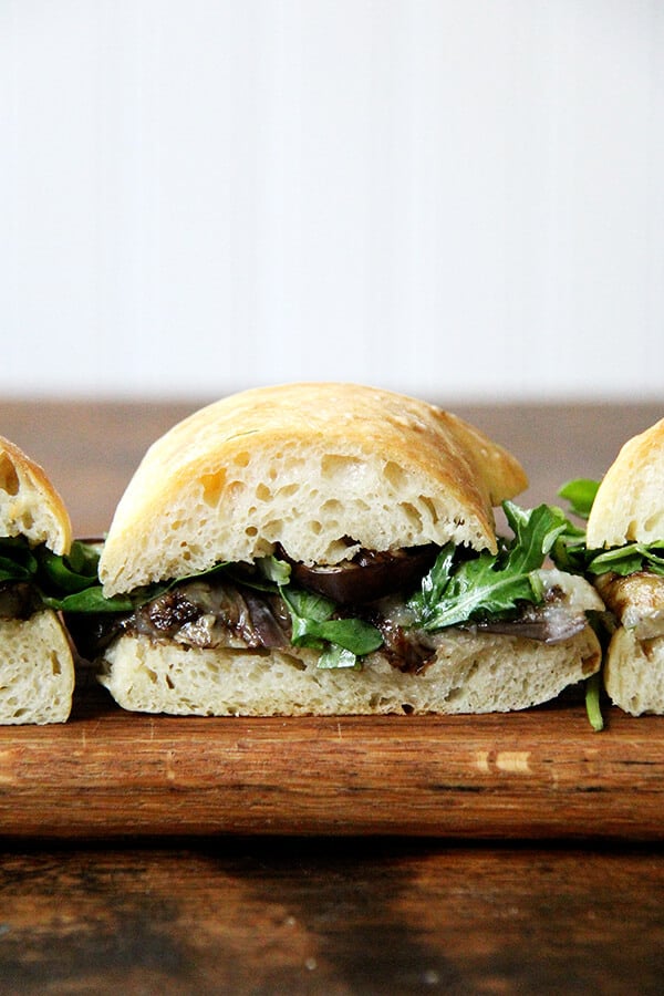 These sandwich rolls are a simple variation of the peasant bread recipe. If you take 5 minutes to mix the dough together this evening, you will be rewarded with the makings of a super-simple Friday night dinner, delicious vessels fit for flanking whatever your heart desires, but may I suggest balsamic-roasted eggplant and arugula? It's so good. // alexandracooks.com