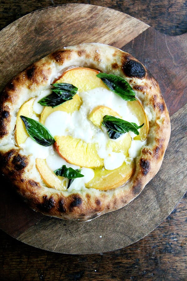Here are recipes for three summer pizzas — peach and basil, broccoli rabe and sausage, and roasted red pepper and tomato — plus a few pizza-making tips. And even in the summer heat, each colorful crème fraîche-slicked pie makes every second spent in my sultry kitchen well worth it. // alexandracooks.com