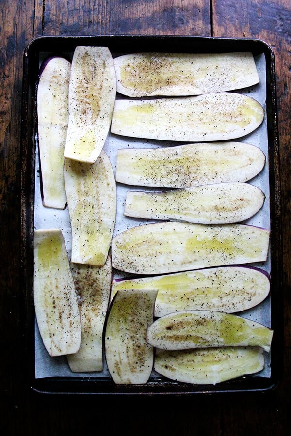 sliced eggplant on a sheet pan