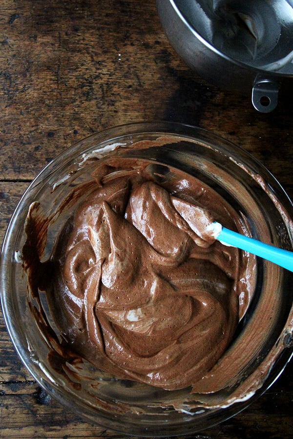 A bowl of melted chocolate mixed with aquafaba.
