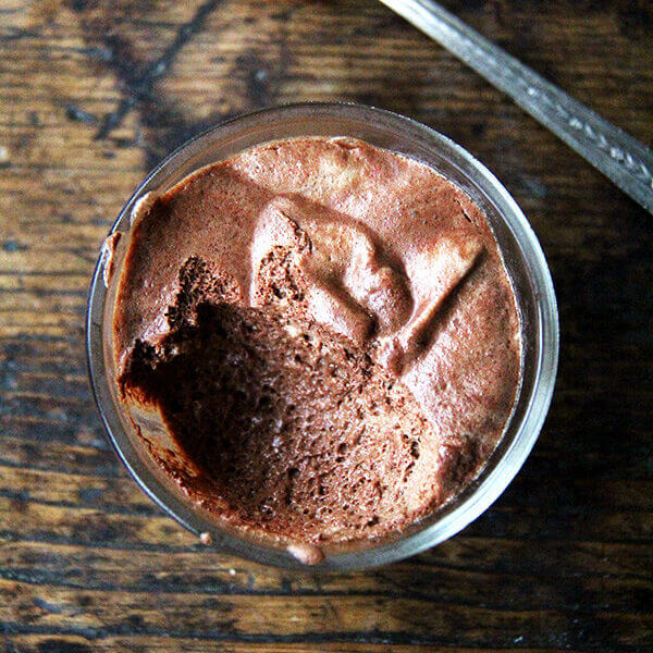 A bowl of homemade vegan chocolate mousse made with whipped aquafaba.