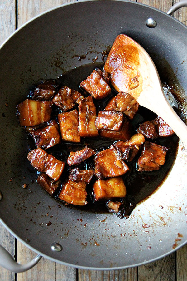 This glazed pork belly with tender cubes of pork in a rich, sweet sauce comes together quite simply. Parboil the meat. 2. Melt sugar in a little bit of water until it begins to caramelize. 3. Glaze the meat in this caramelizing sugar. 4. Add aromatics and some liquids and cook until done. // alexandracooks.com
