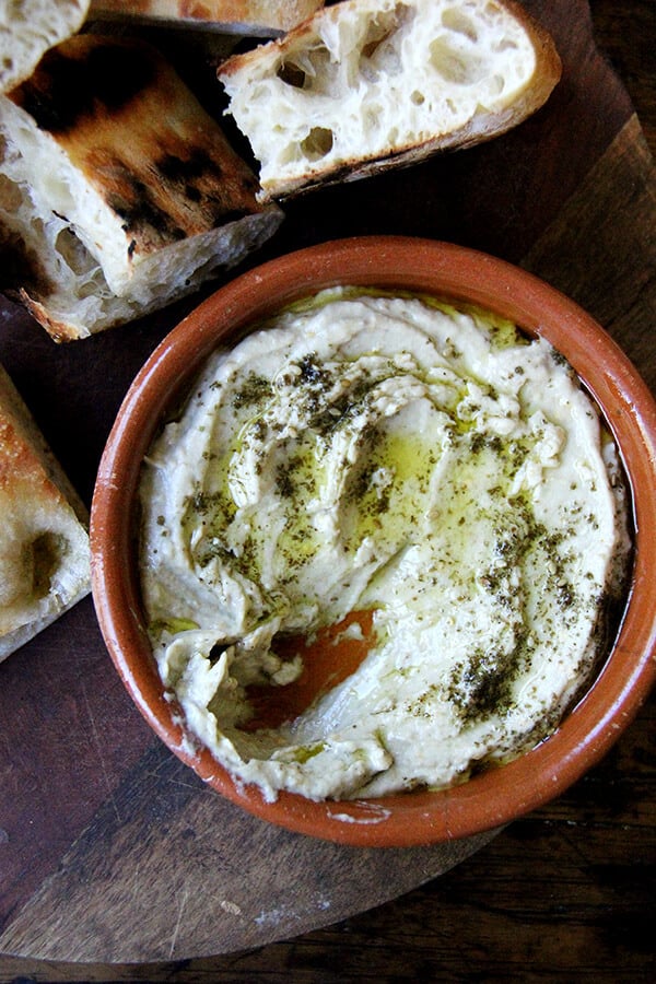 This smoky eggplant dip calls for charring whole eggplant on a grill or over an open flame until the skin is blackened. The rest is easy: pulse the eggplant flesh in a food processor with tahini, Greek yogurt, salt, and fresh lemon, and before serving, drizzle with olive oil and sprinkle with za'atar. Yum. // alexandracooks.com