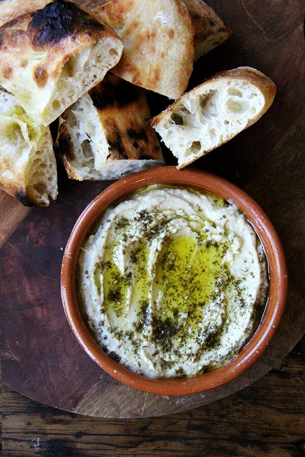 This smoky eggplant dip calls for charring whole eggplant on a grill or over an open flame until the skin is blackened. The rest is easy: pulse the eggplant flesh in a food processor with tahini, Greek yogurt, salt, and fresh lemon, and before serving, drizzle with olive oil and sprinkle with za'atar. Yum. // alexandracooks.com