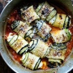 A pan of baked zucchini involtini.