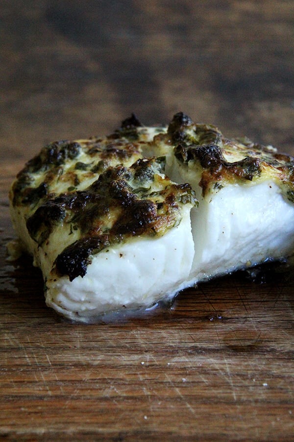 Here, a simple mixture of mayonnaise, mustard, capers, lemon zest and parsley has been spread atop the halibut fillets before cooking. It browns beautifully under the broiler, creating a thin, tasty crust. The fish needs nothing more than a squeeze of lemon upon serving. // alexandracooks.com