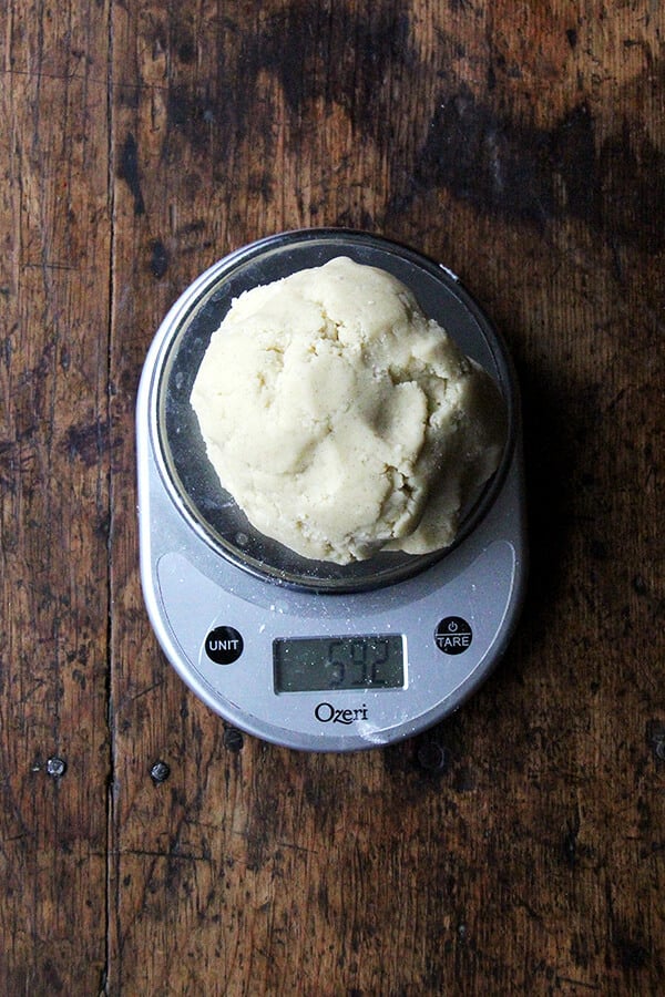 A scale with sablé cookie dough on top.