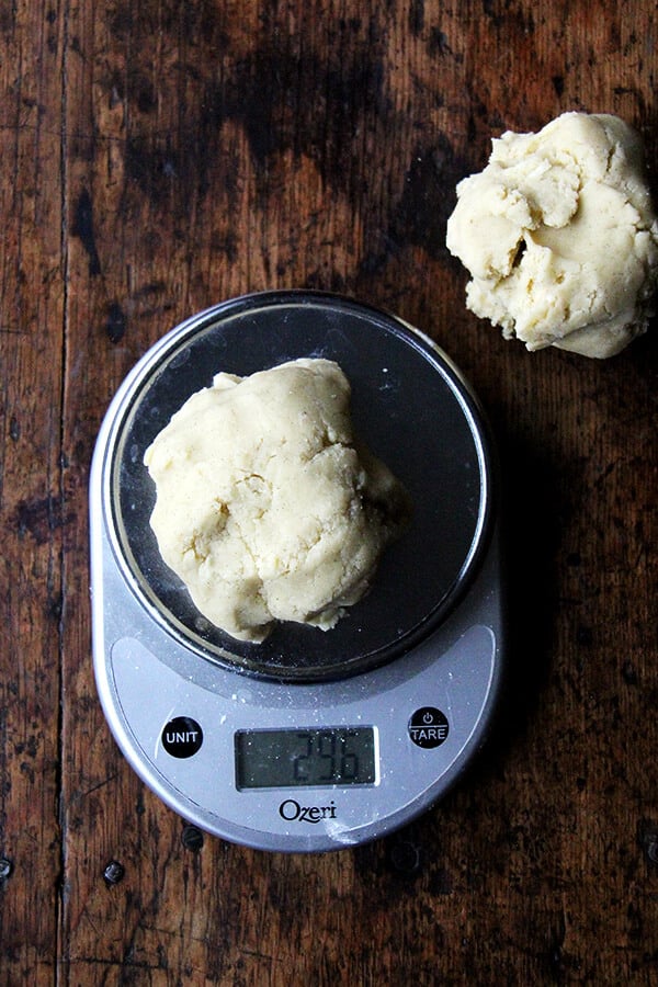 A scale with sablé cookie dough on top.