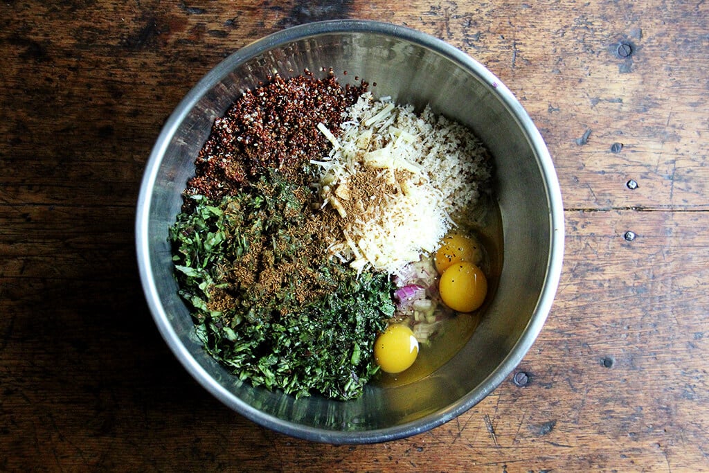 ingredients to make crispy quinoa cakes in a bowl