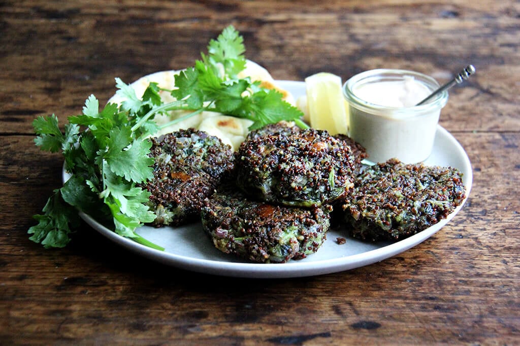 crispy quinoa cakes with mustard greens