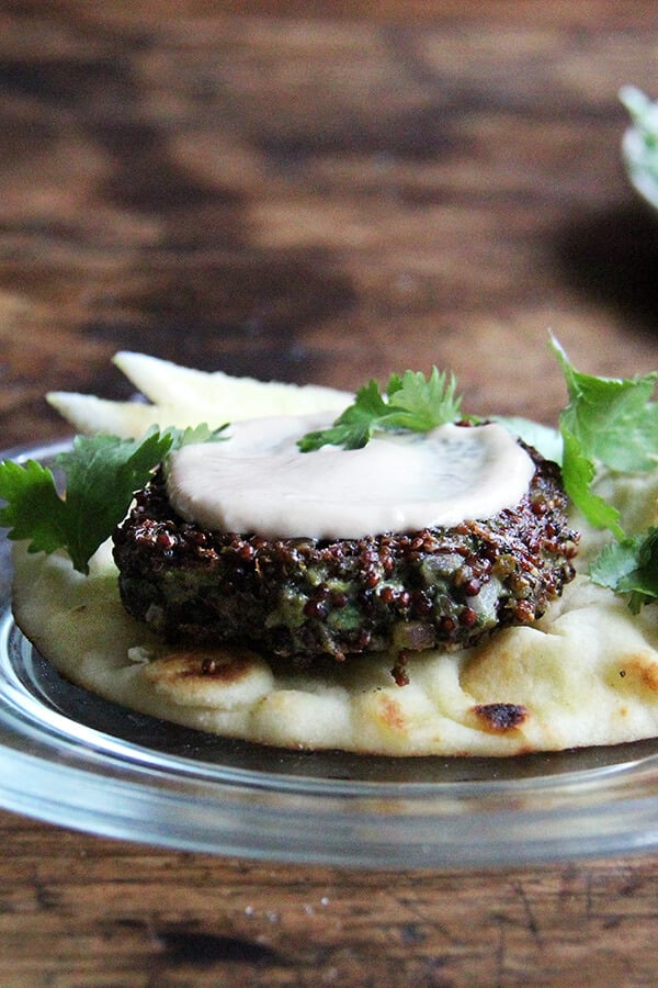 A plate topped with a crispy quinoa cake. 