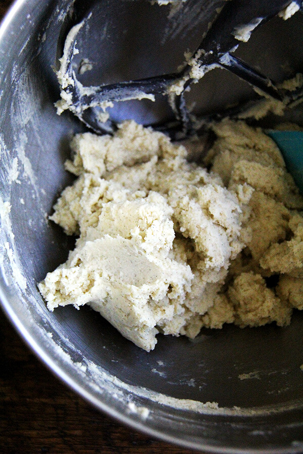 A stand mixer filled with vanilla bean sablé cookie dough batter.