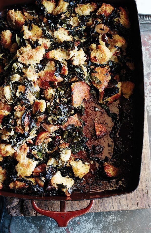 Sometimes all you want is a no-frills stuffing: bread tossed with seasoning, mixed with copious amounts of butter, onions, and celery. But sometimes you want a stuffing studded with dried cranberries and chestnuts, laced with sweet onions (also sautéed in copious amounts of butter), strewn with kale that crisps up like chips as irresistible as the crusty cubes it surrounds. You can have both. // alexandracooks.com