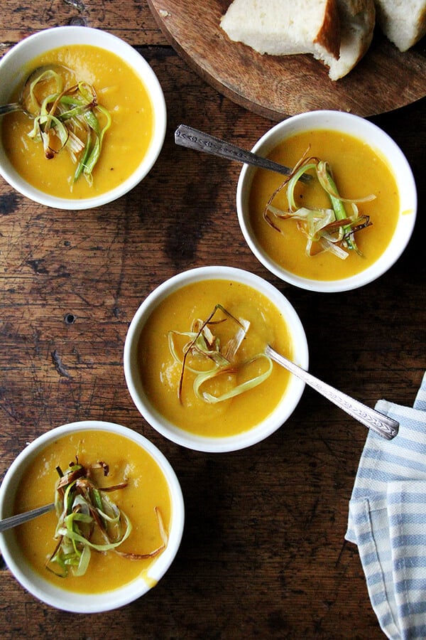 Slow cooker butternut squash soup with apple and coconut milk in bowls.