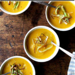 Bowls of butternut squash and apple soup.
