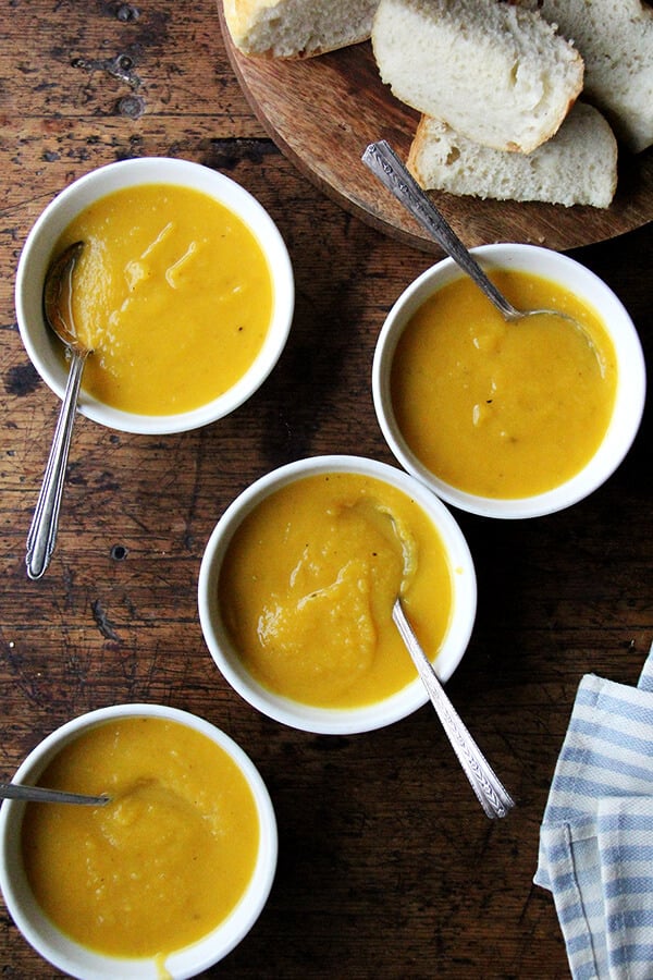 Bowls of butternut squash and apple soup.