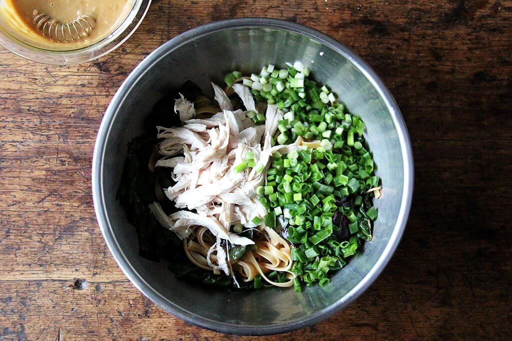 adding the chicken and scallions