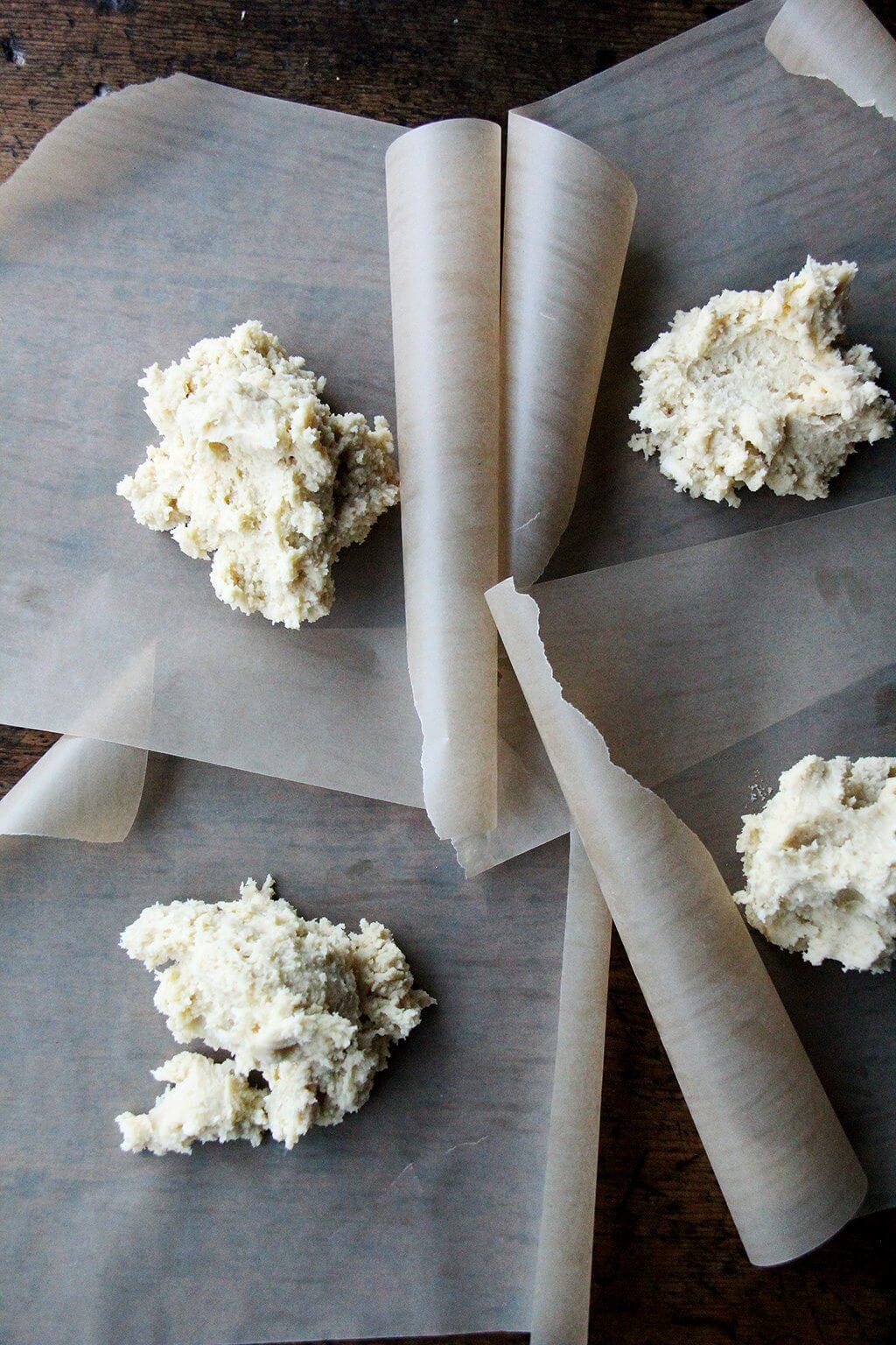 Classic cream cheese cookie dough divided into four portions.