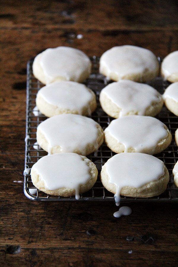 Glazed cookies on a cooling rack.