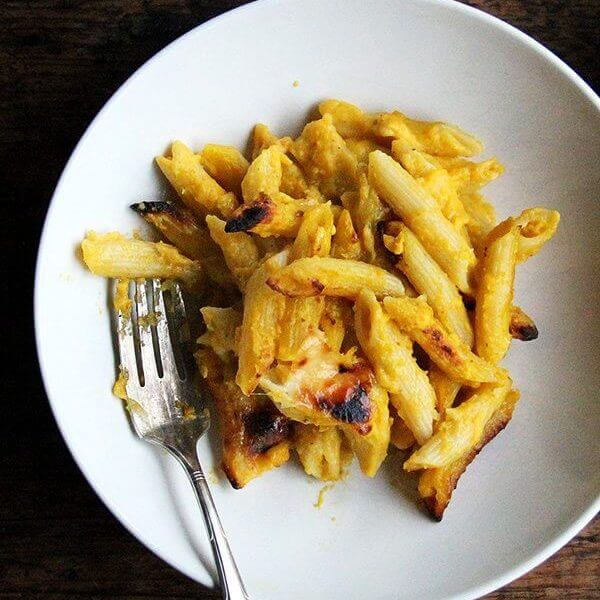 A bowl of baked penne with butternut sage sauce.