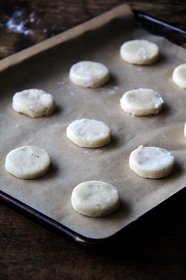 Classic cream cheese cutout cookies on a sheet pan ready for the oven.
