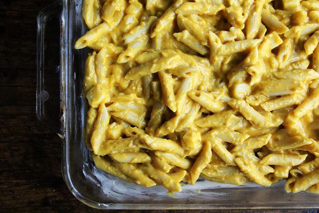 A 9x13-inch pan filled with penne tossed with butternut squash sage sauce. 