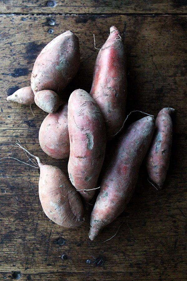 sweet potatoes on a board