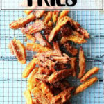 A tray of just fried thick-cut sweet potato fries.