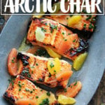 A sizzle platter holding broiled Arctic char.