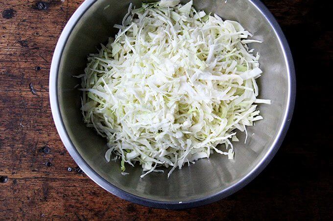Shredded cabbage in a large bowl.