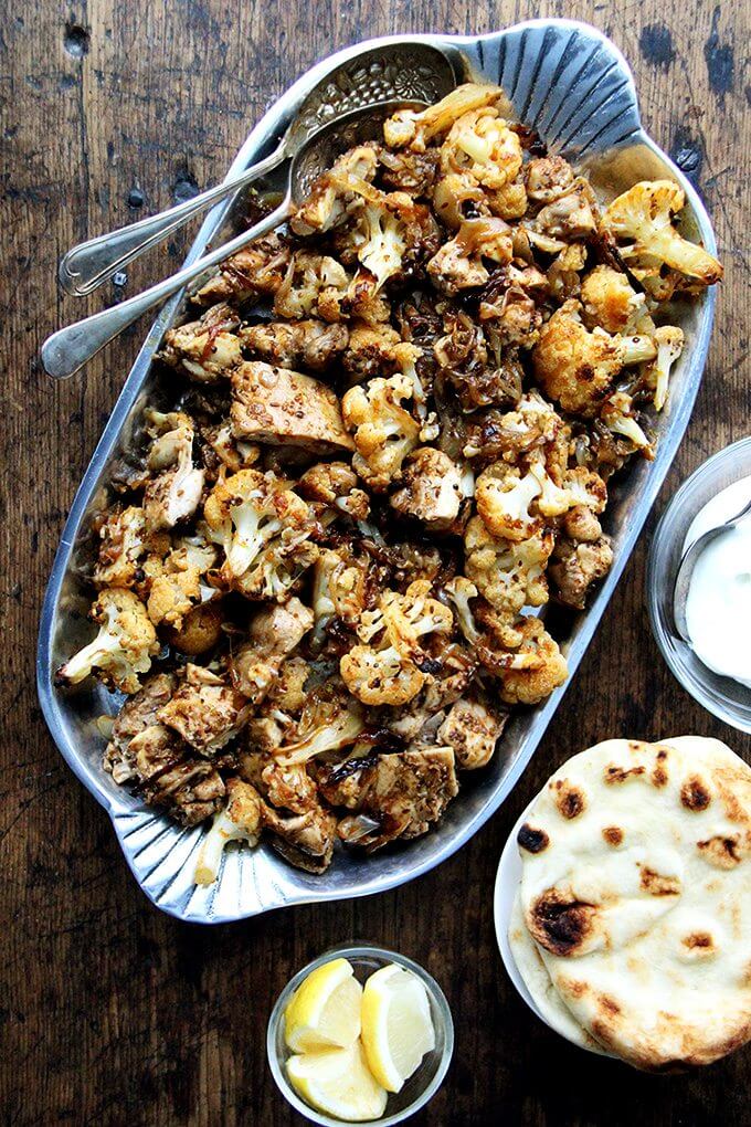 A platter of sheet pan chicken and cauliflower shawarma.