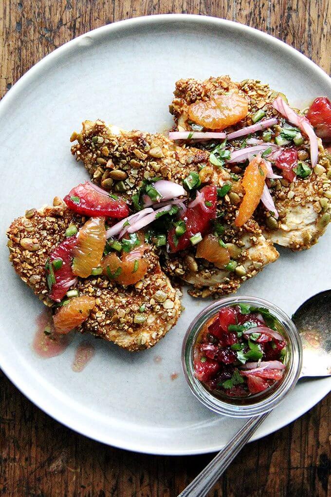 Here's the gist of these pepita-crusted chicken cutlets: toast pumpkin seeds, crush them coarsely, mix with a few spices (smoked paprika or ancho chile powder, cumin and cayenne), then use them to "bread" your cutlets. If you love panko chicken and are looking for a little change, give this one a go—the seeds add such a lovely texture and flavor. // alexandracooks.com