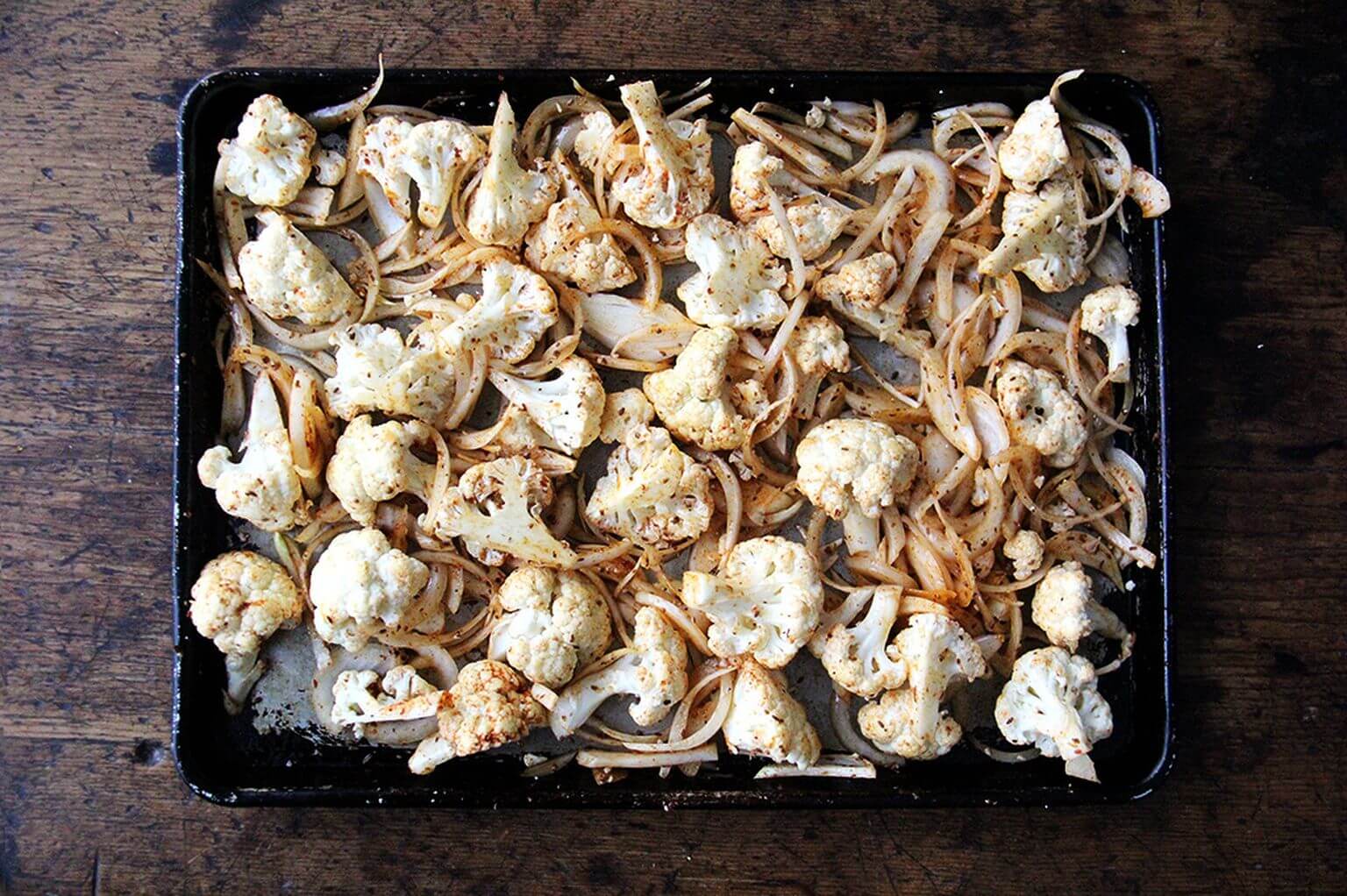 A sheet pan of cauliflower and onions with shawarma spices. 