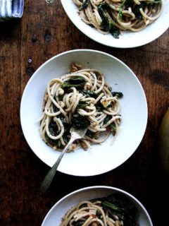 This pasta with spinach, walnuts, and lemon includes fresh greens tossed with a garlicky, white wine sauce made slightly creamy with crème fraîche. Yum. // alexandracooks.com