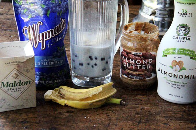 Ingredients to make blueberry-almond smoothie.