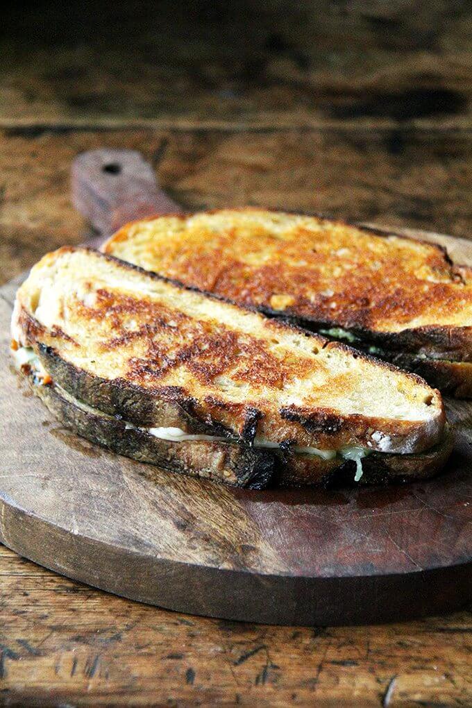 This ‘nduja grilled cheese includes Wisconsin fontina, a great melting cheese, and basil pesto, to offer a fresh counterpoint to the richness of the pâte-like spread. In keeping with the Italian theme, I sandwiched the three ingredients between thick slices of ciabatta, whose porous crumb so nicely absorbed the flavors of the spicy ‘nduja and sweet, earthy fontina. Yum. // alexandracooks.com