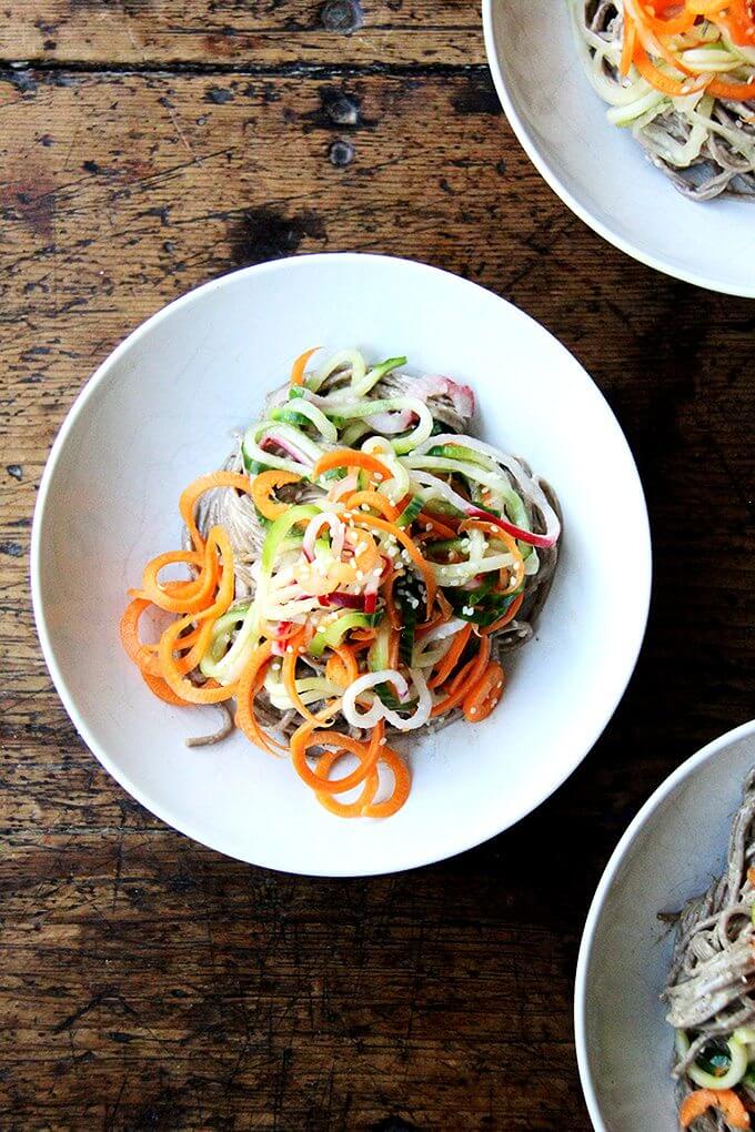 This recipe for almond-sesame soba noodles with quick-pickled vegetables is really fun and super easy. It's also a good one to rely on in the summer — it's so refreshing — and, if you subscribe to a CSA or tend a prolific garden, it makes great use of all of those carrots, cucumbers, and radishes you may find yourself up to your eyeballs in. // alexandracooks.com