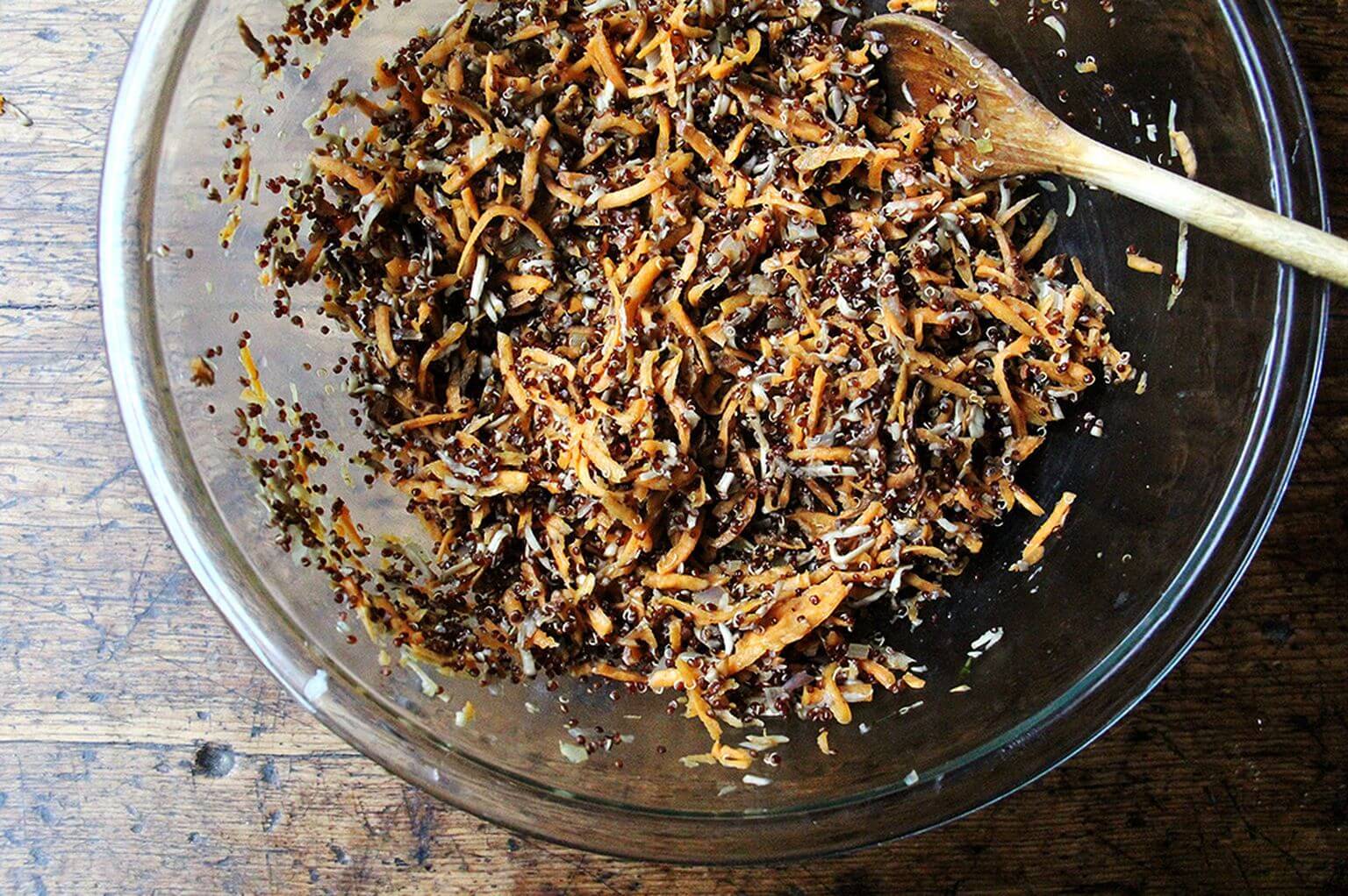 A bowl of grated sweet potatoes and mushrooms for veggie burgers.