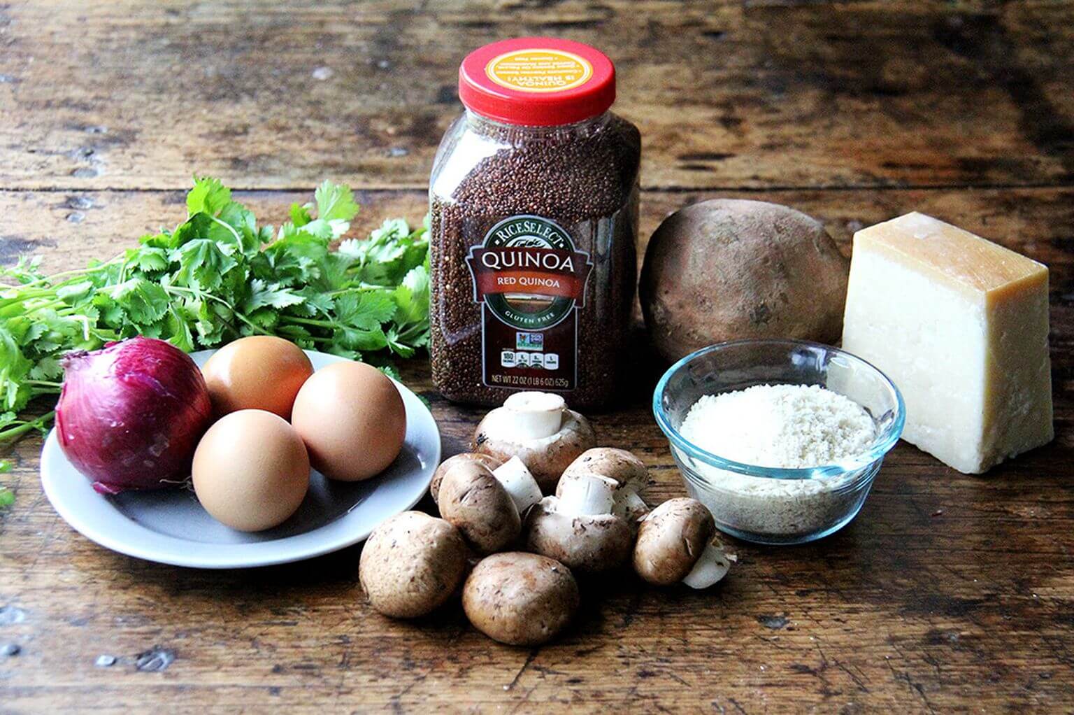 A board filled with the ingredients to make veggies burgers.