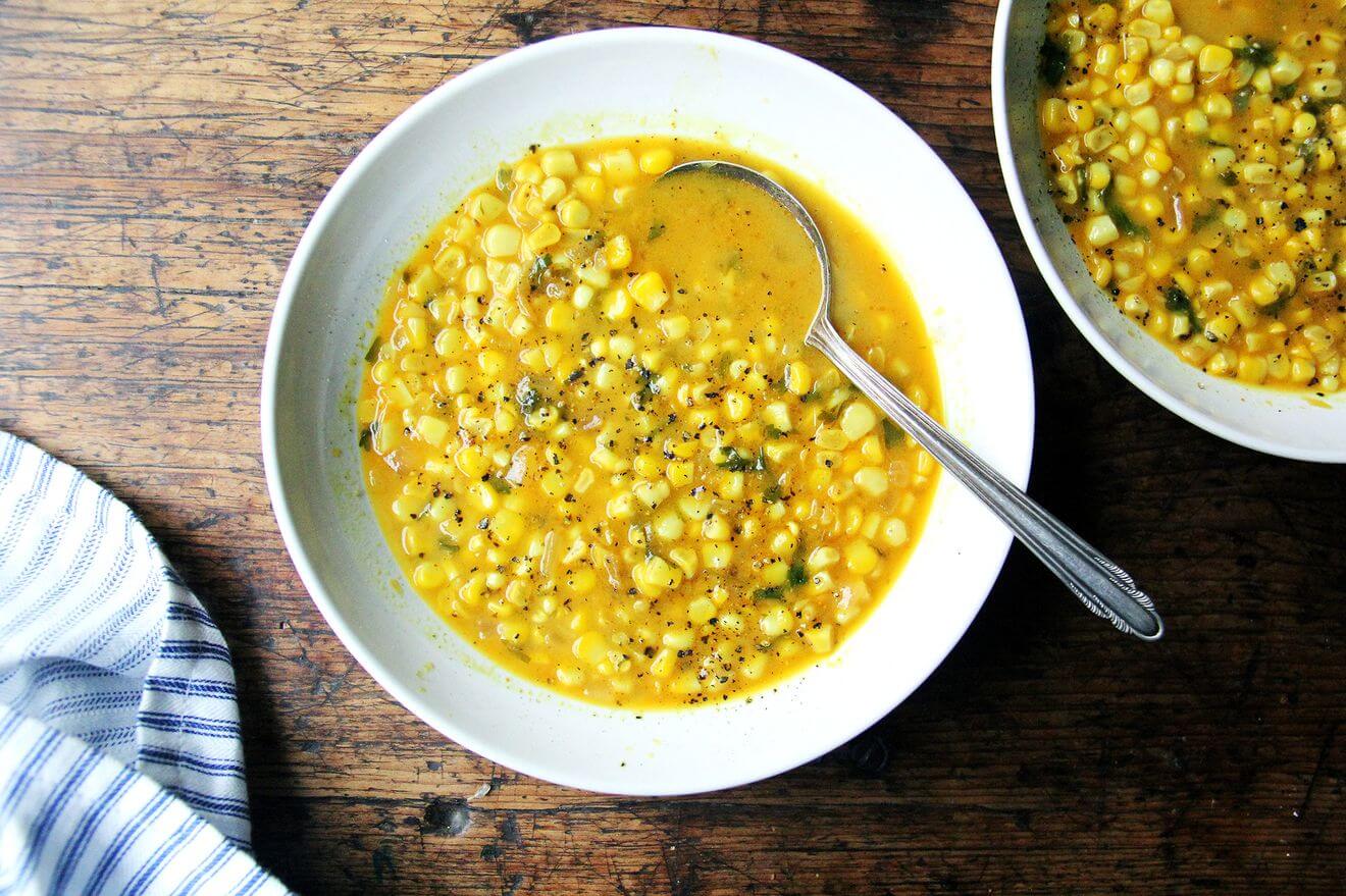 A bowl of curried corn soup.
