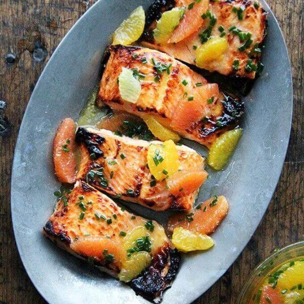A sizzle platter with broiled arctic char and citrus sauce.