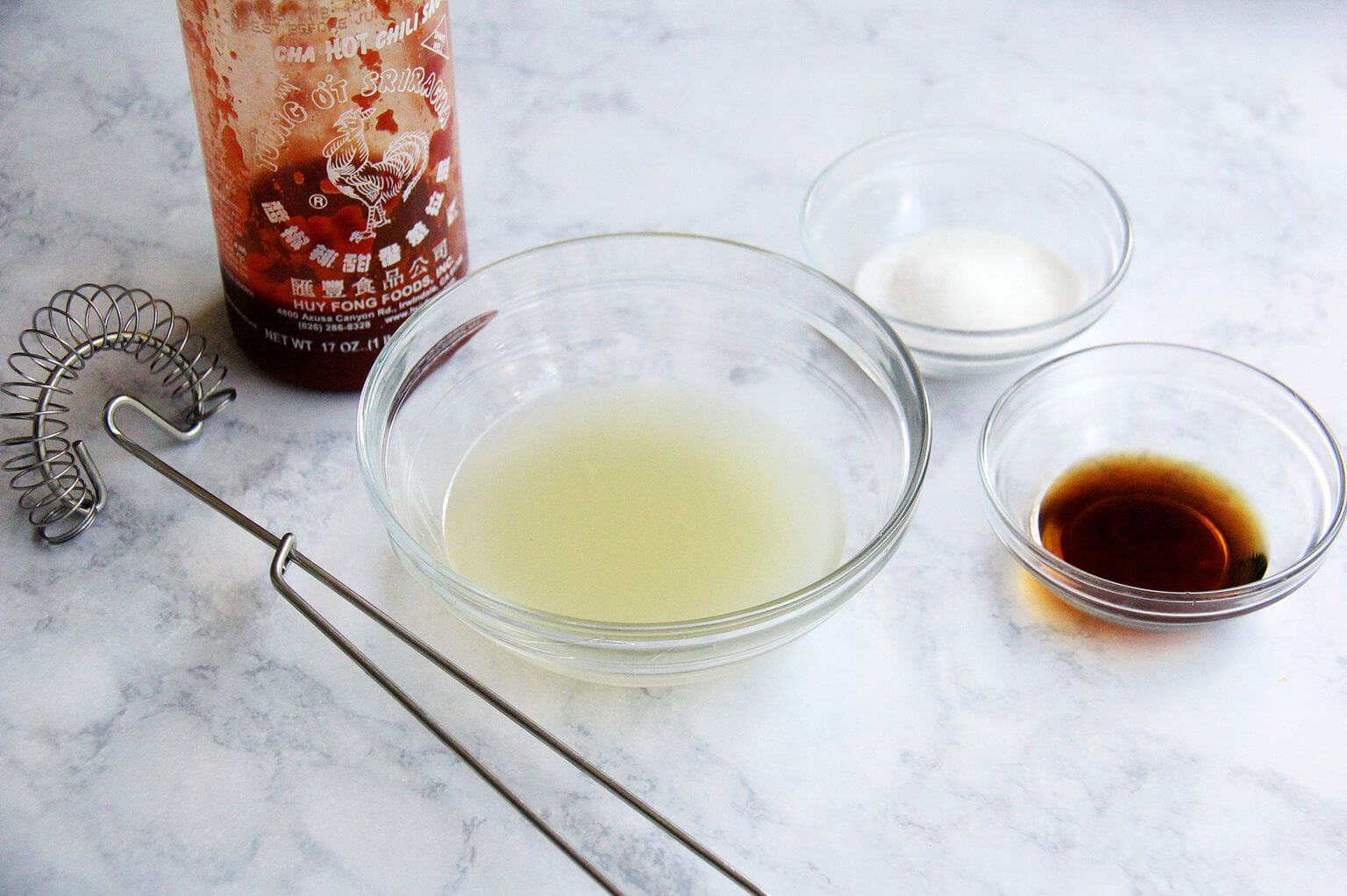 Dressing ingredients for Thai chicken and cabbage salad. 