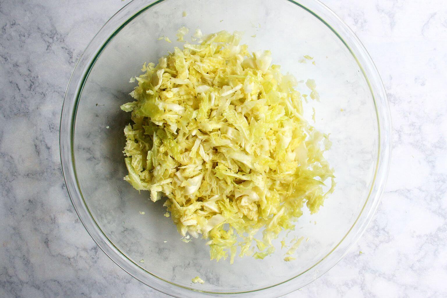 A bowl of massaged cabbage.