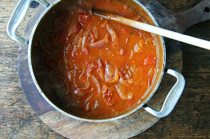 A pot of tomatoes, onions, and butter after an hour of simmering. 