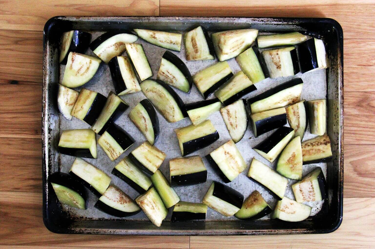 Chopped eggplant on a sheet pan