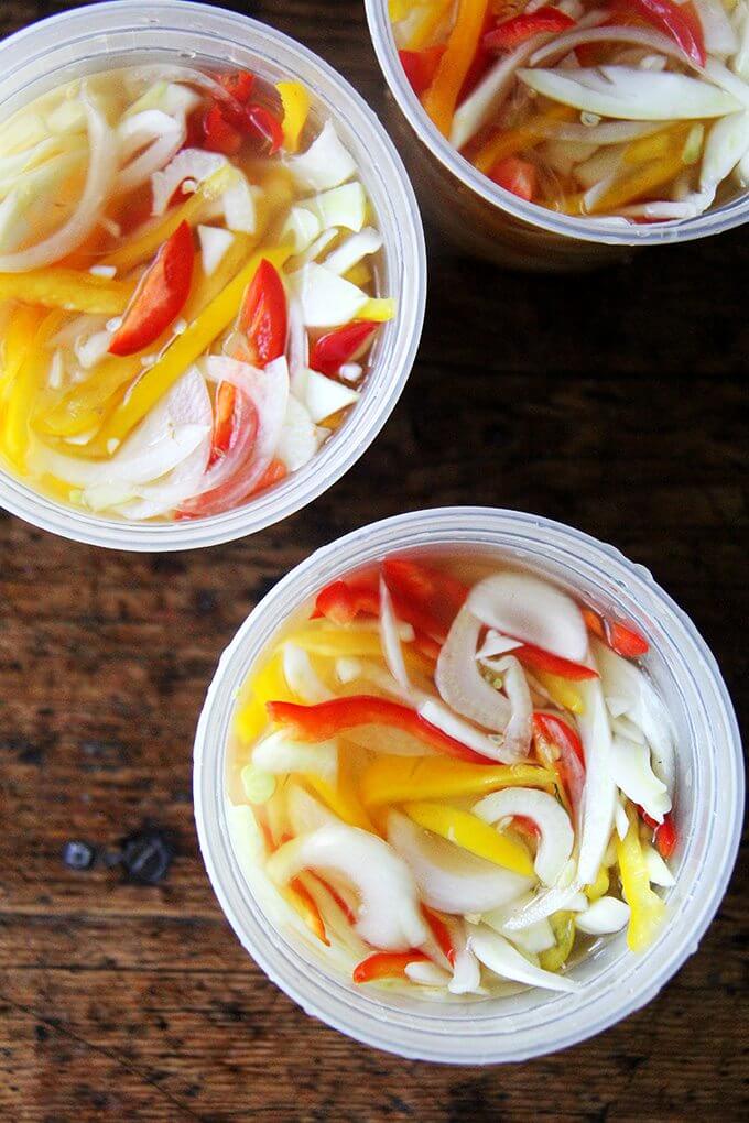 Here I've pickled peppers, onions, and fennel, and I've been tucking the mix into sandwiches, spreading it atop melty cheese toasts, and, as intended, sprinkling it over just-baked pizza. I imagine it would be fabulous with grilled bratwurst or in a Philly cheesesteak-style sandwich. // alexandracooks.com