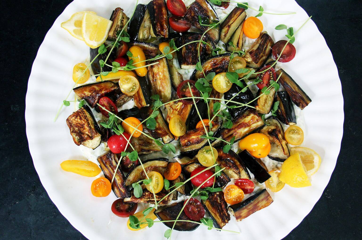 Roasted eggplant, tomato, and tzatziki salad.