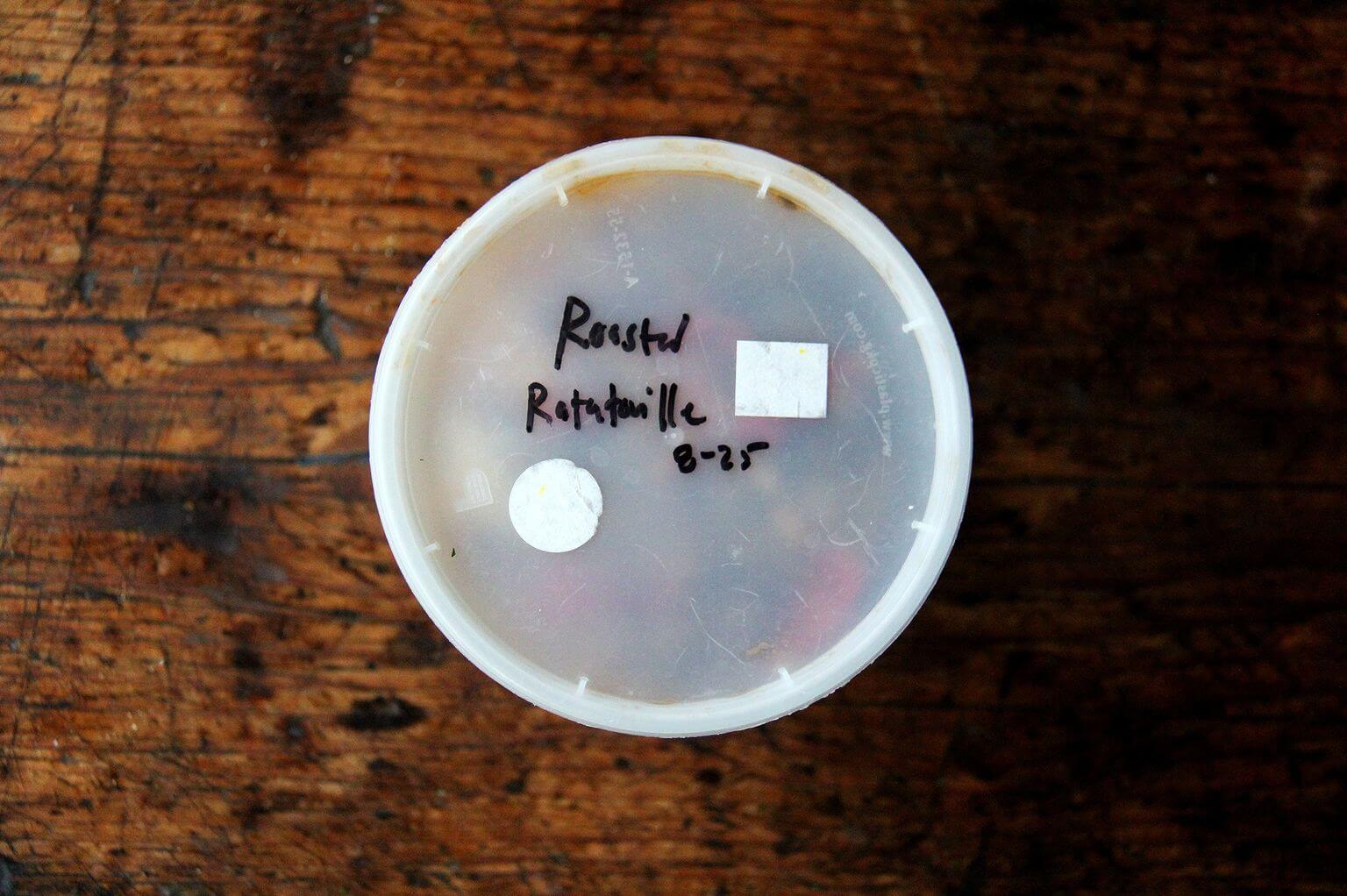 A quart container packed with roasted ratatouille.