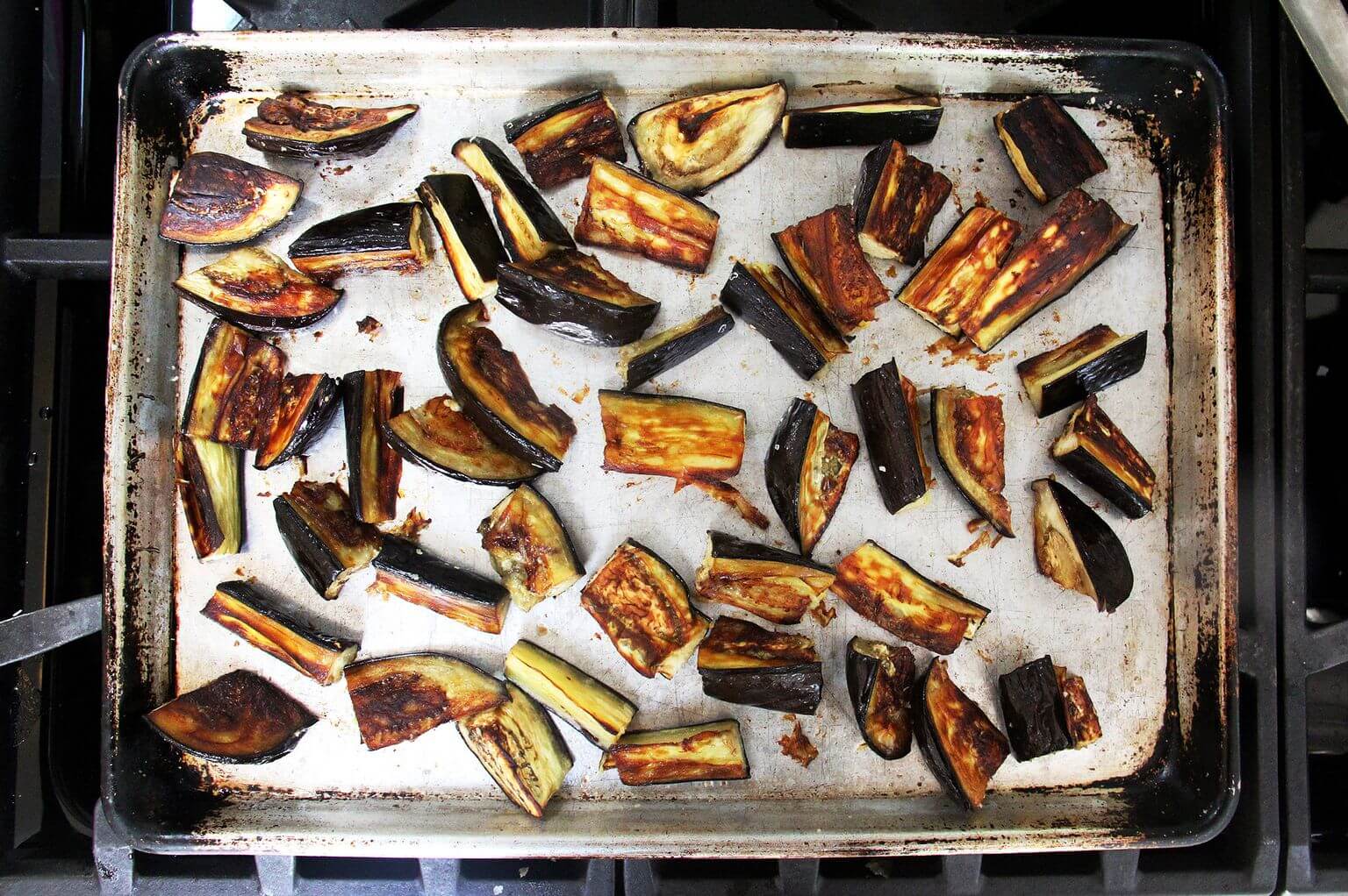 A sheet pan of roasted eggplant.